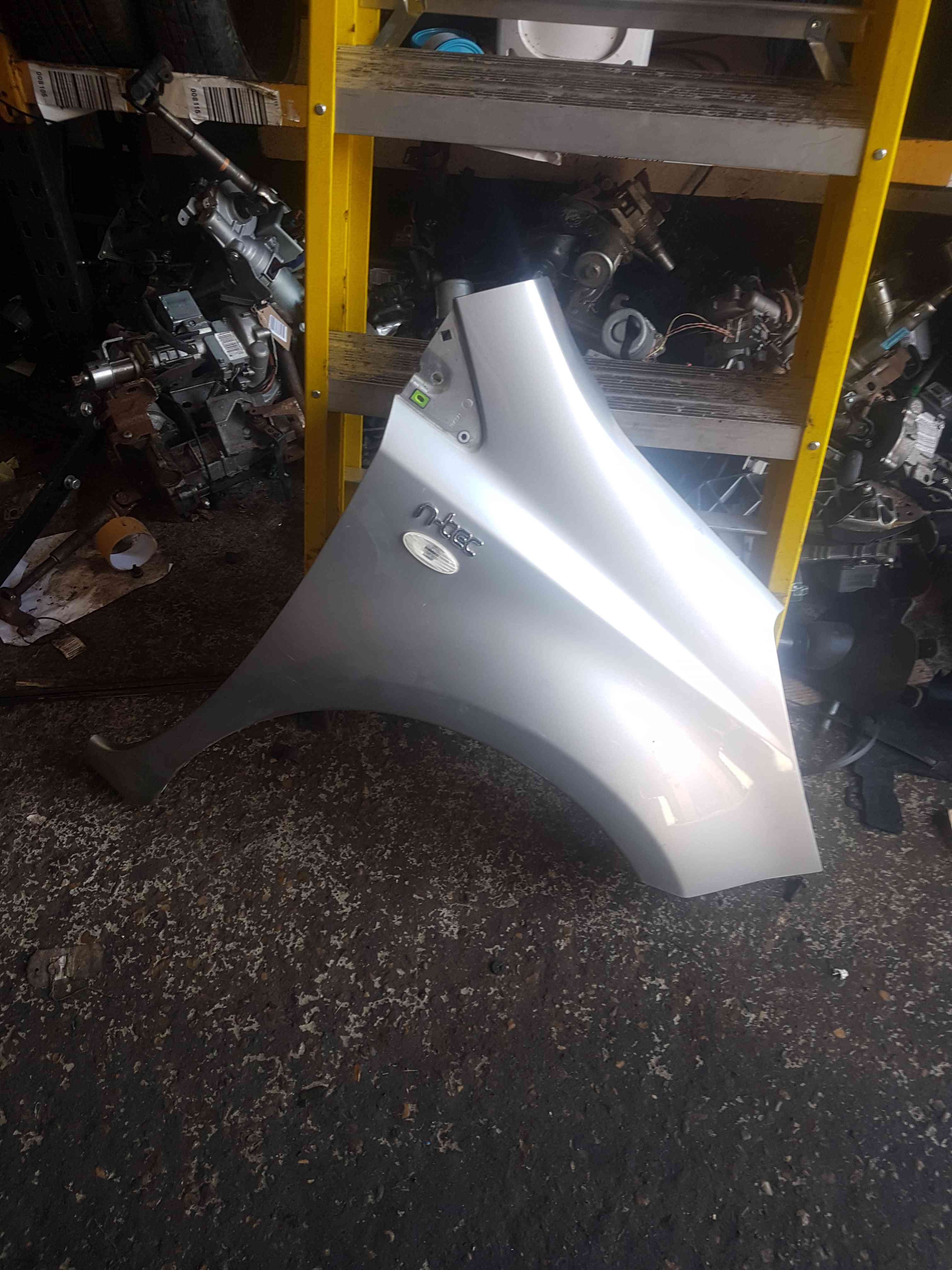 Thumb 7 Nissan Note E11 2005-2012 Driver Os OSF Wing KYO Silver Metallic